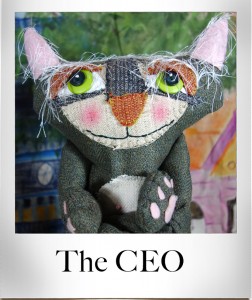 A whimsical stuffed cat doll made from an old suit jacket.