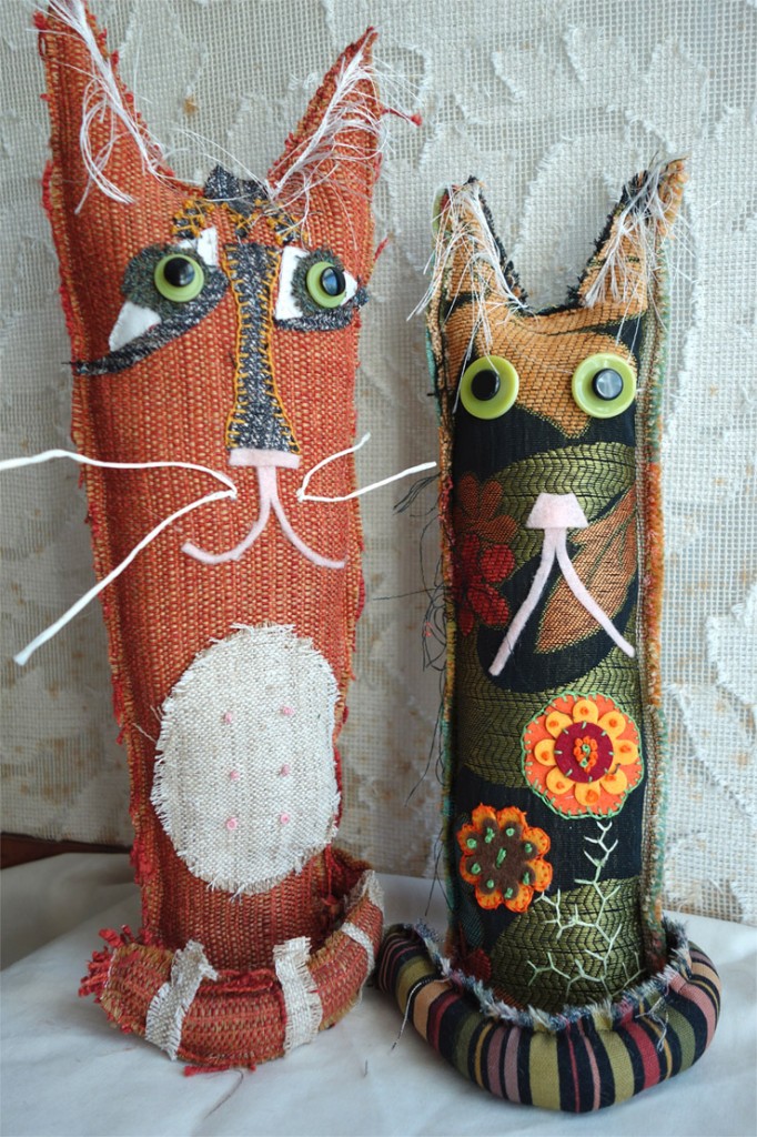 Cute cats made out of fabric scraps.