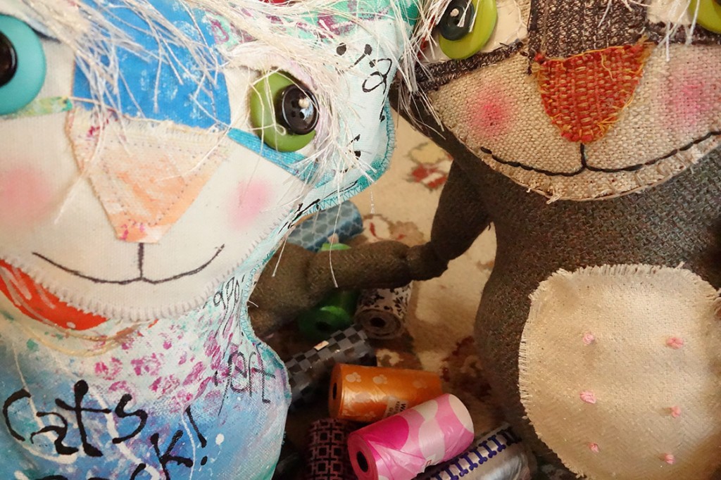 Cat dolls take a selfie photo with all the colorful objects.