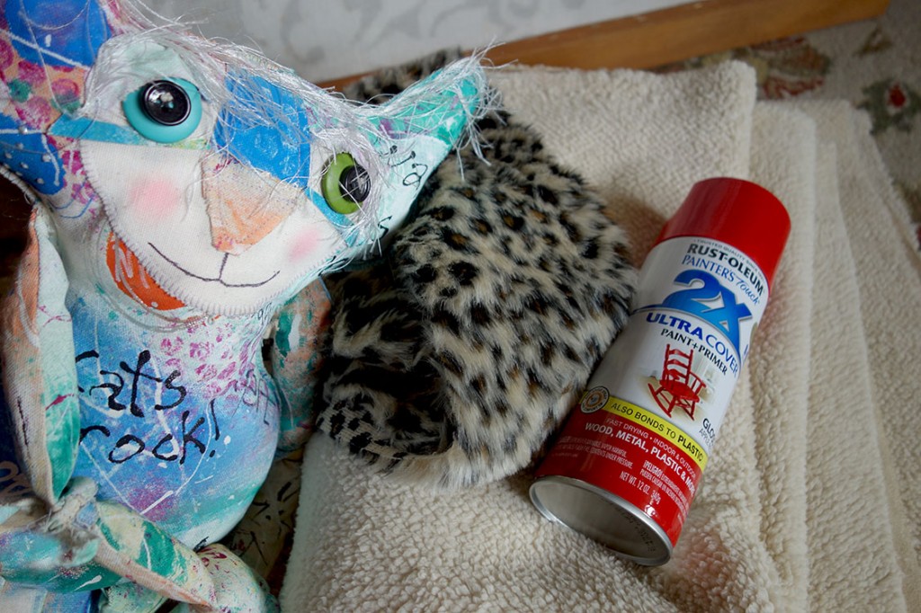 The Chairman poses with high-end sheepskin fabric, a flubby animal print and a can of red glossy spray paint.