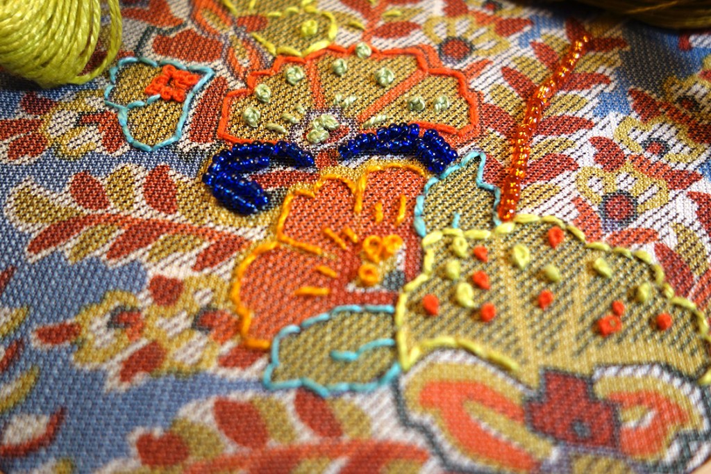 Closeup of colorful embroidery and beading.