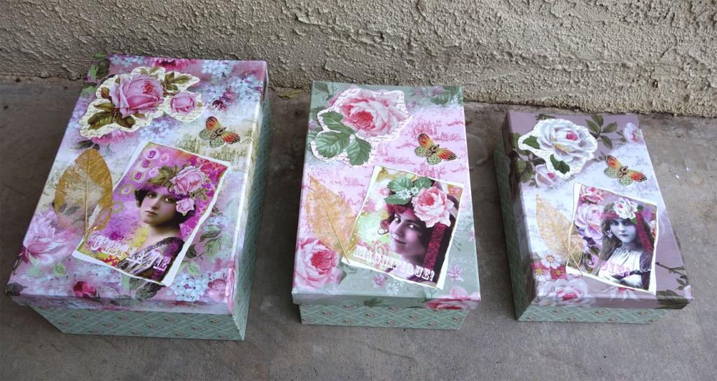 Three lovely, floral boxes in small, medium and large with chipboard cutouts fastened on top of butterflies and flowers.