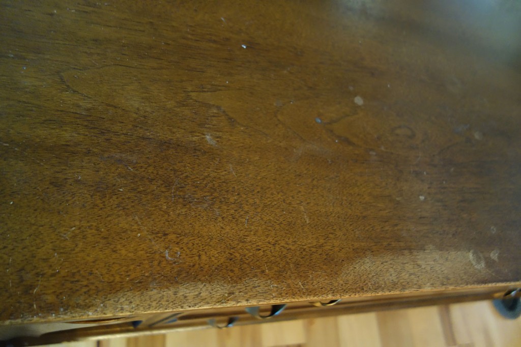 Detail shot of the wear and tear on the top of the credenza.