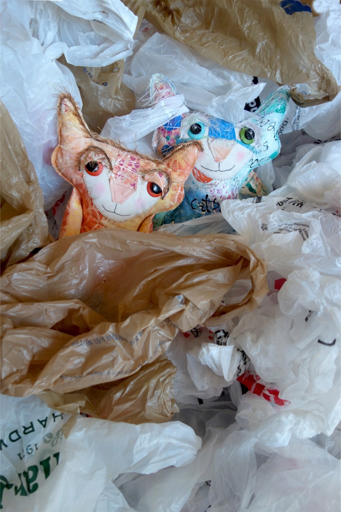 The Chairman and Ginger are buried amongst a very large number of plastic shopping bags.