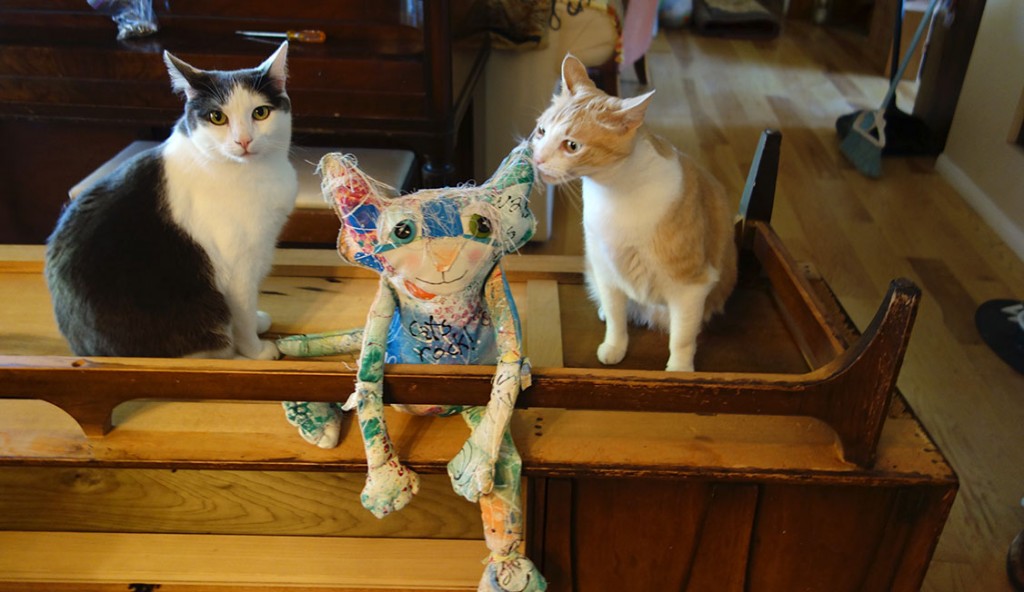Wally and Melvin (the real life cats) and The Chairman sit on the up ended credenza.