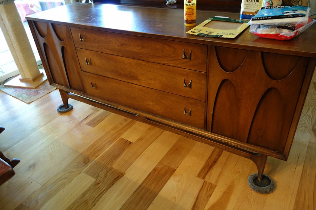 A mid-century modern credenza needing a bit of tender loving care.