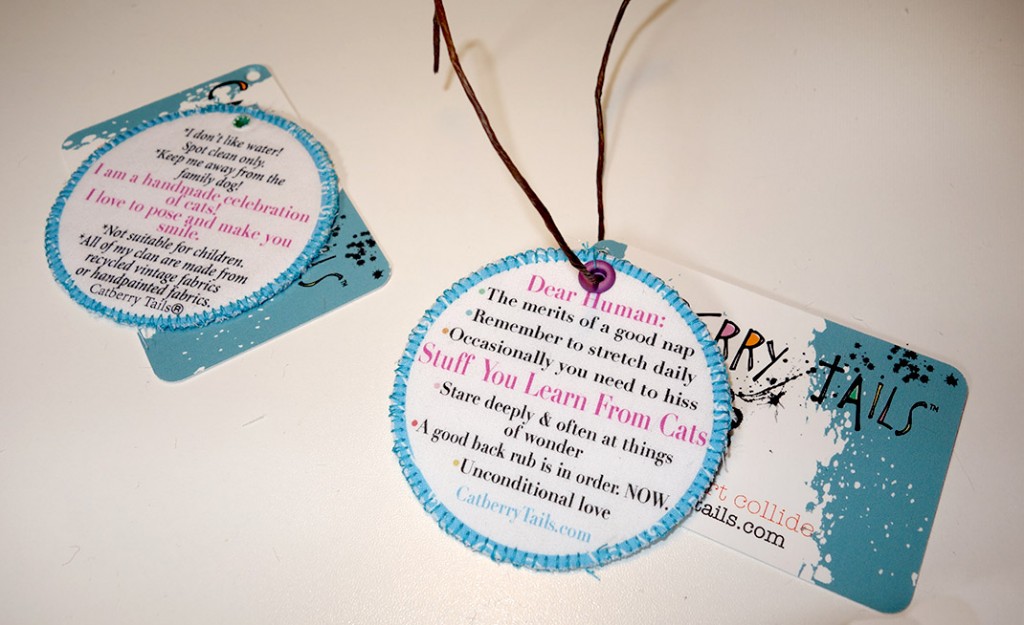 The doll tags, complete with instructions of care and a list including things you learn from cats. Stuff like stretch daily, hiss as needed, unconditional love, etc.