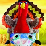 The Chairman Cat doll is wearing an hilarious Thanksgiving turkey hat.