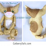 Adorable soft sculptured cat named Sherlock. He is gold color with soft butterscotch color patches. His tail is striped.