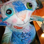 The Chairman of Catberry Tails. A very colorful soft sculpture cat made from hand painted fabric. One of the first dolls made!